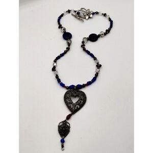 Vintage Filigree Heart Shaped Pendant on Necklace of Glass Beads in Red and Blue